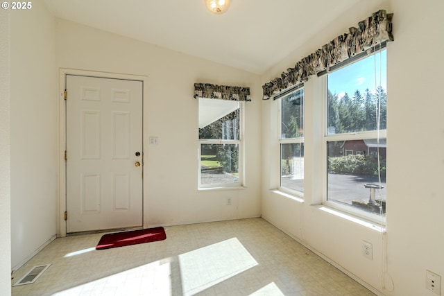 interior space featuring a healthy amount of sunlight, visible vents, and tile patterned floors