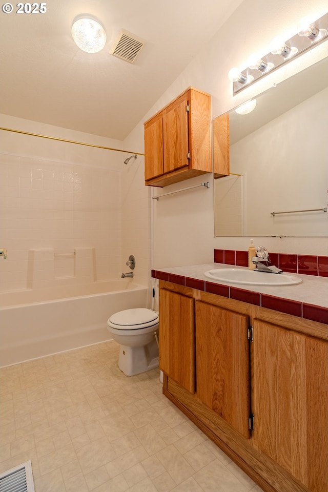 bathroom with visible vents, shower / tub combination, vanity, and toilet