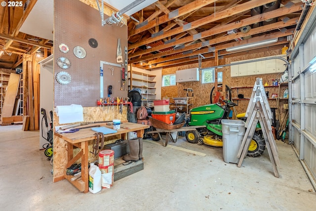 garage with a workshop area