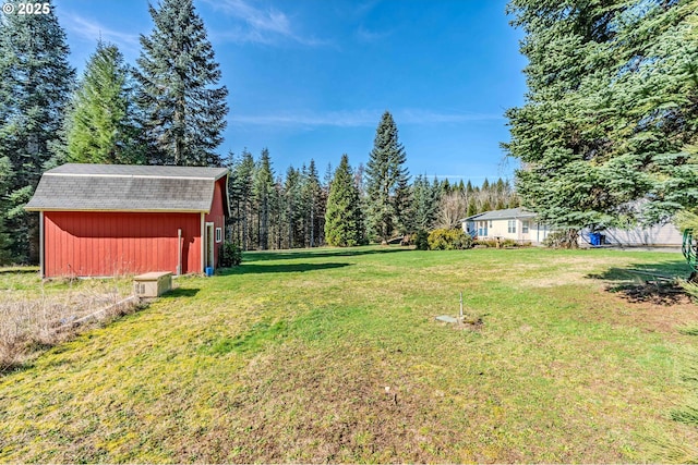 view of yard with a barn and an outdoor structure