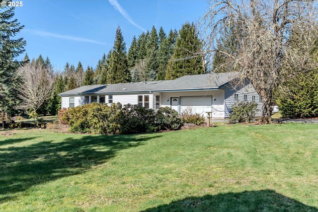 ranch-style home with a front lawn and an attached garage