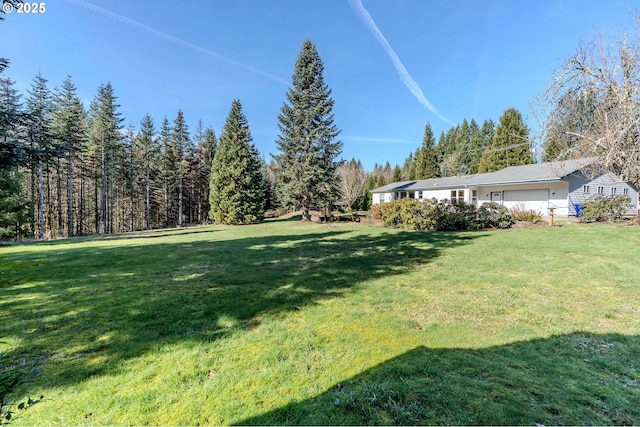 view of yard featuring a garage