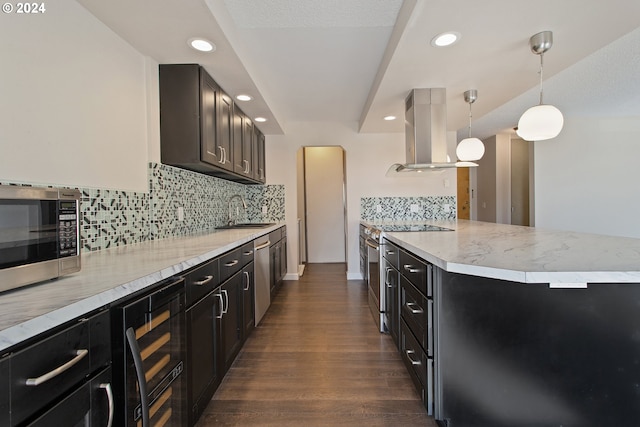 kitchen with sink, island range hood, dark hardwood / wood-style flooring, hanging light fixtures, and stainless steel appliances