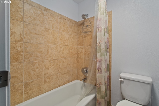 bathroom with toilet and shower / bath combo