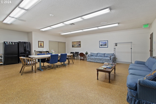 living room featuring a textured ceiling