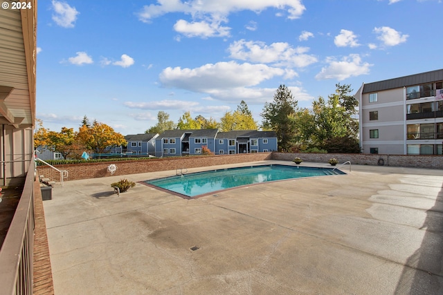 view of swimming pool with a patio area