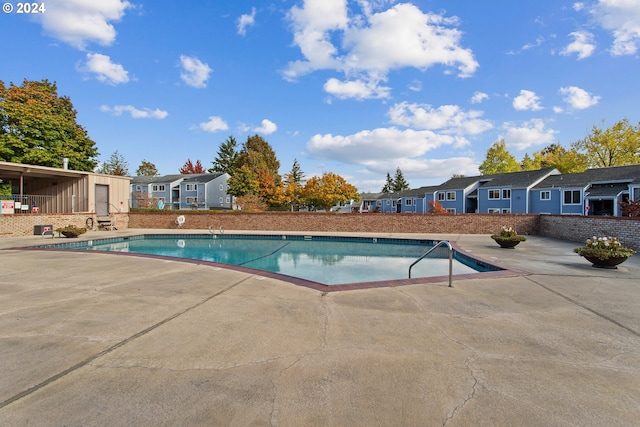 view of pool featuring a patio