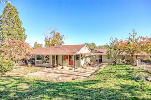 view of front of property with a front lawn and a patio