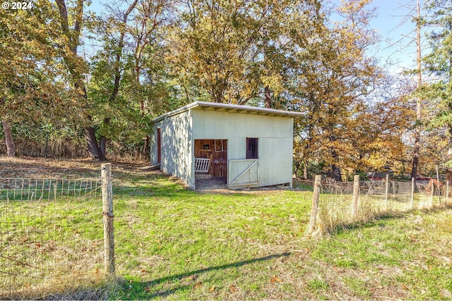 view of outdoor structure with a yard