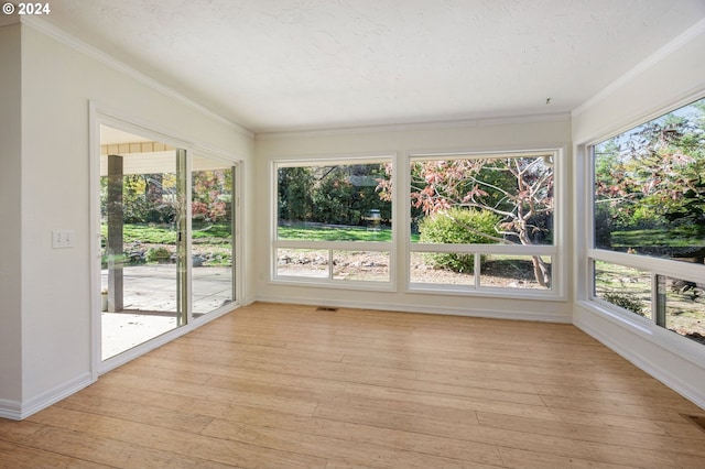 unfurnished sunroom featuring plenty of natural light