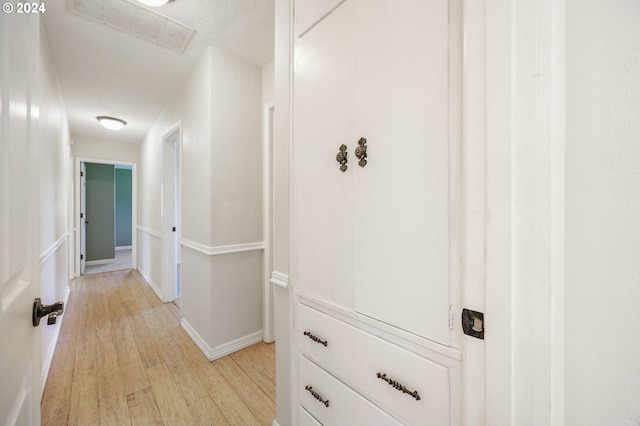 hall with light hardwood / wood-style flooring