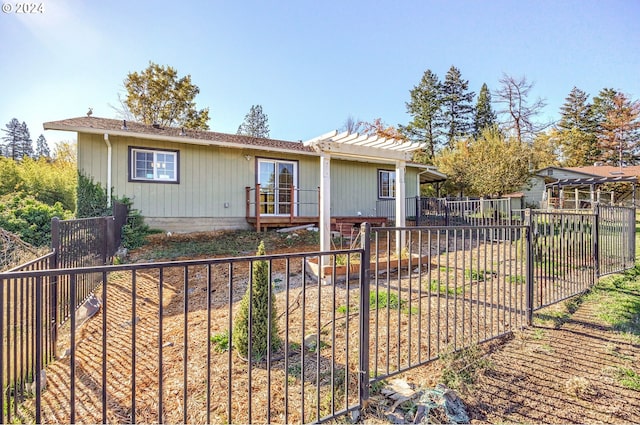 view of front of home with a pergola