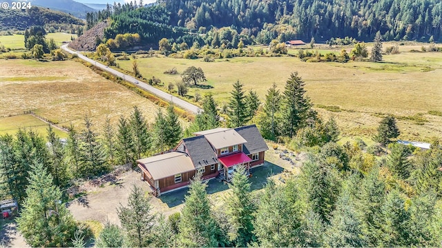 aerial view with a mountain view and a rural view