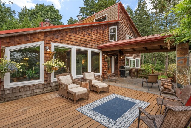 wooden deck featuring area for grilling