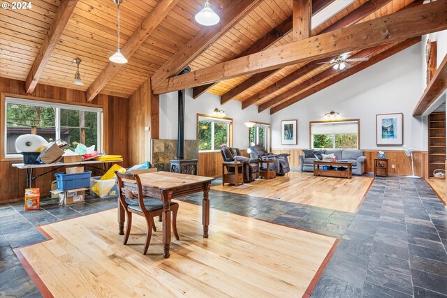 tiled dining room featuring beam ceiling, high vaulted ceiling, and wooden ceiling