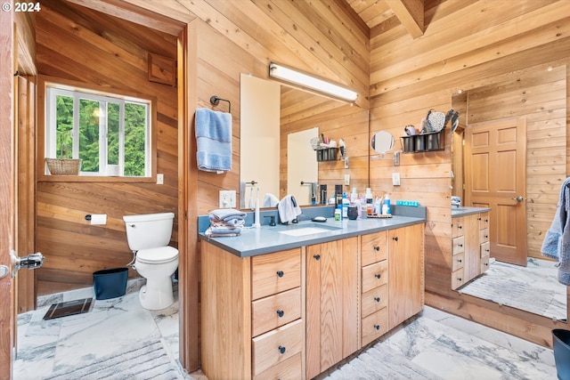 bathroom with wood walls, wooden ceiling, tile patterned flooring, vanity, and toilet