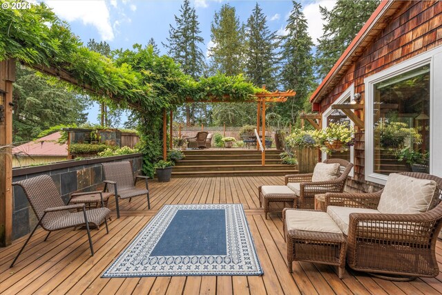 wooden terrace featuring outdoor lounge area