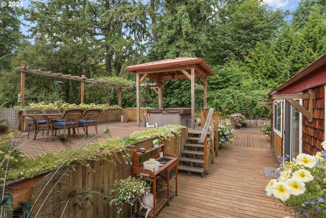 wooden deck with a hot tub