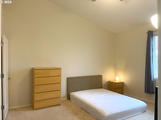 bedroom featuring light colored carpet