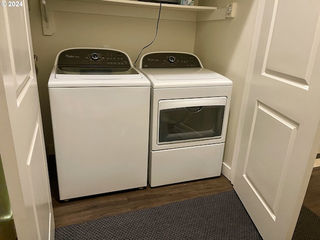 clothes washing area featuring dark wood-type flooring and independent washer and dryer