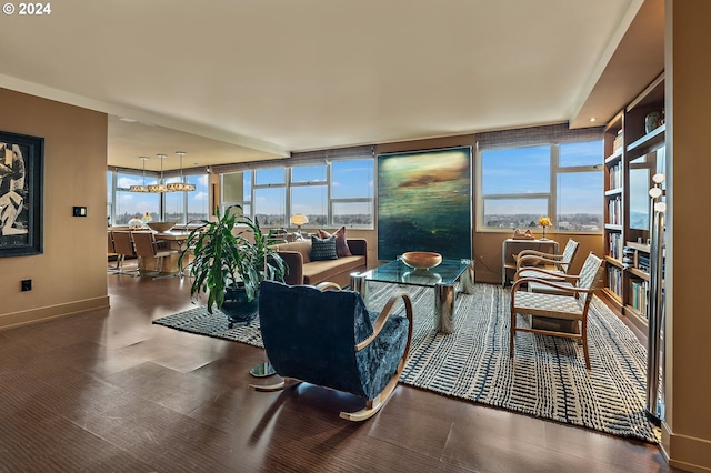 living room with a wall of windows and a healthy amount of sunlight