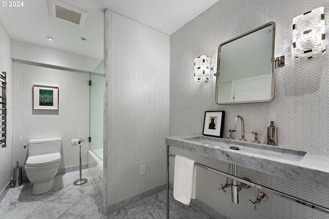 1220 NE 17th Ave Unit 17H, Portland, OR 97232 - full bath featuring toilet and marble look tiles