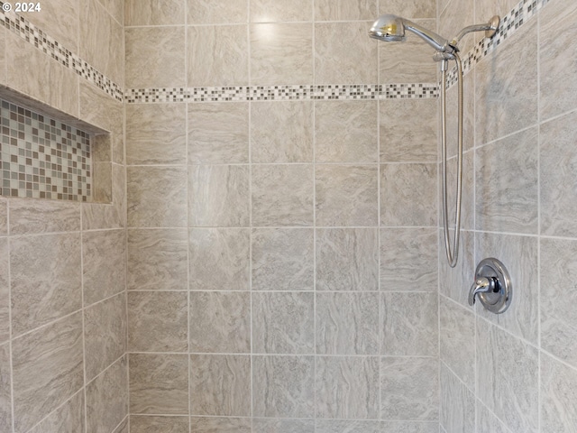 bathroom with tiled shower