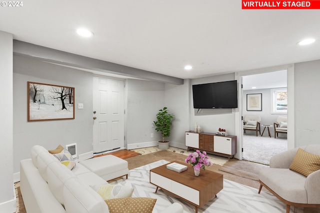 living area with visible vents, recessed lighting, baseboards, and light wood finished floors