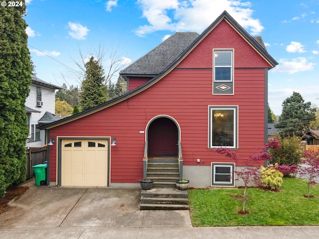 view of front of property with a shingled roof, a front lawn, fence, entry steps, and concrete driveway