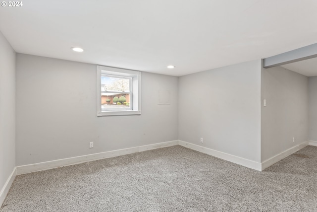 carpeted empty room featuring recessed lighting and baseboards