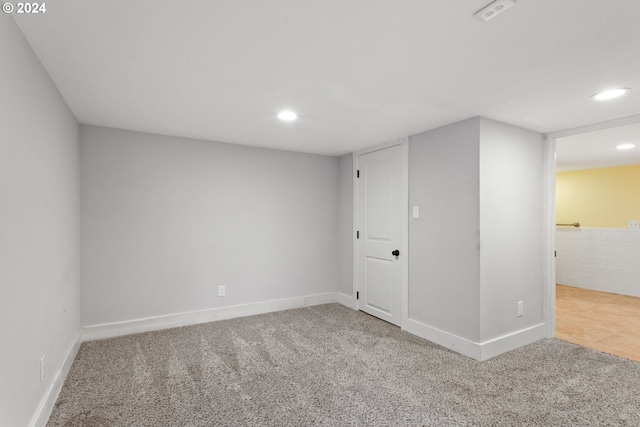 carpeted empty room with recessed lighting and baseboards