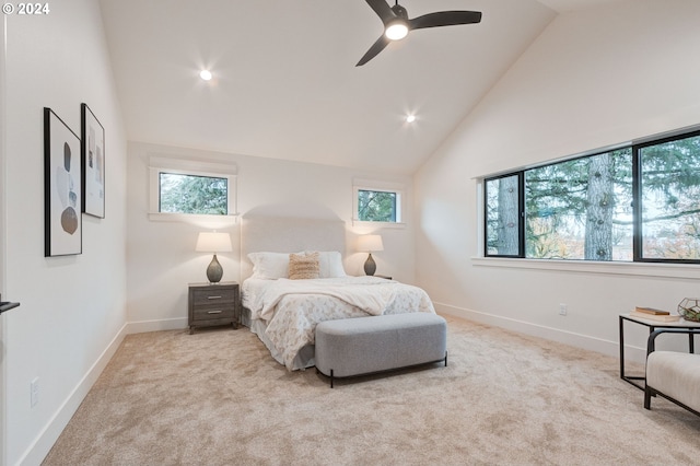 bedroom featuring light carpet, lofted ceiling, and ceiling fan