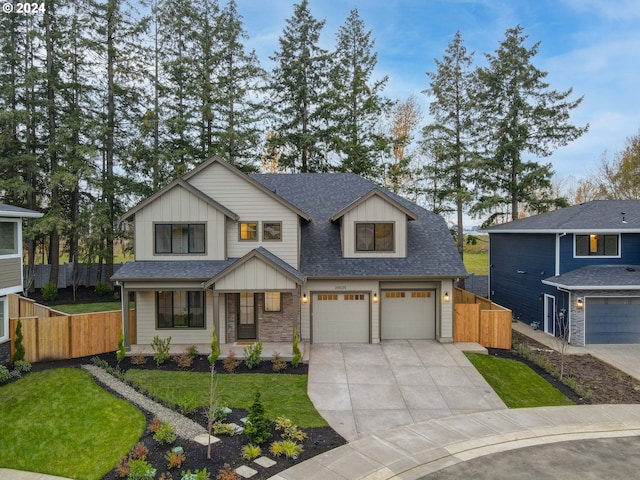 view of front of property with a garage and a front lawn