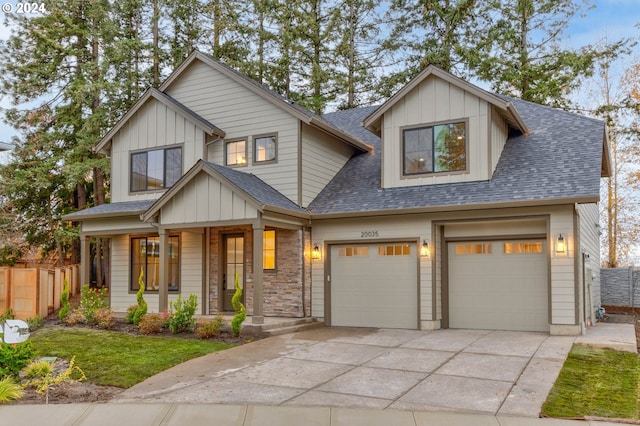 craftsman inspired home featuring a garage and a porch