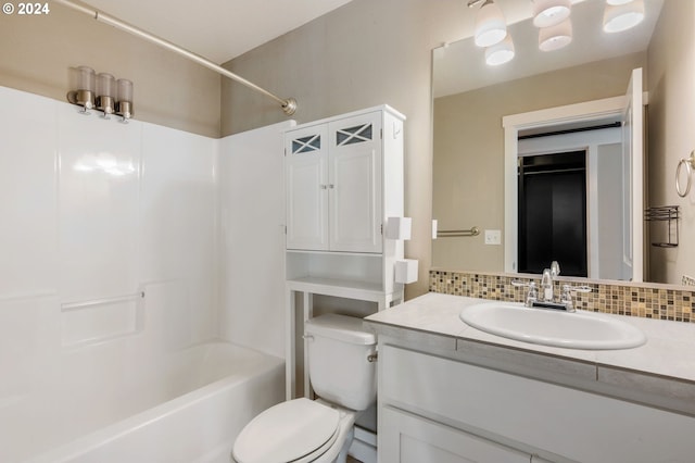 full bathroom featuring vanity, toilet, bathtub / shower combination, and tasteful backsplash