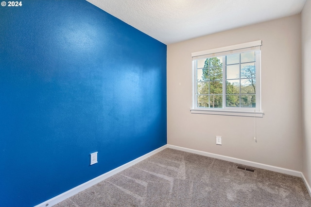 unfurnished room with carpet floors