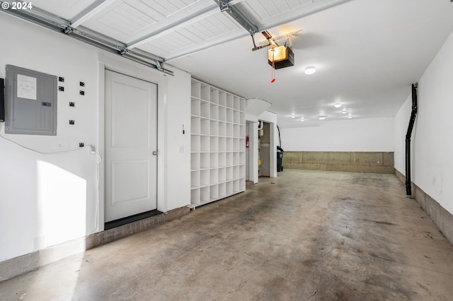 garage with electric panel and a garage door opener