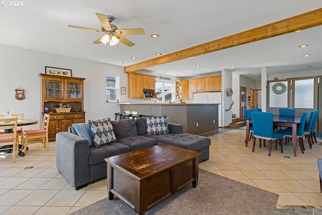 tiled living room featuring beam ceiling and ceiling fan