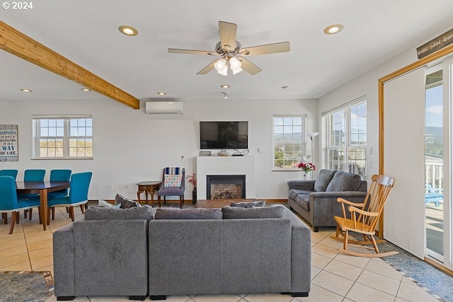 tiled living room featuring ceiling fan, beamed ceiling, a wall mounted AC, and a healthy amount of sunlight