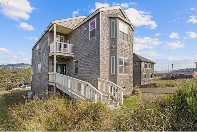 view of property exterior with a balcony