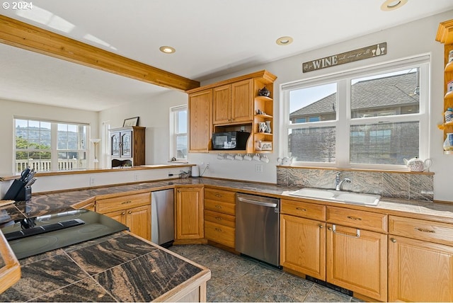 kitchen with sink, stainless steel dishwasher, and beamed ceiling