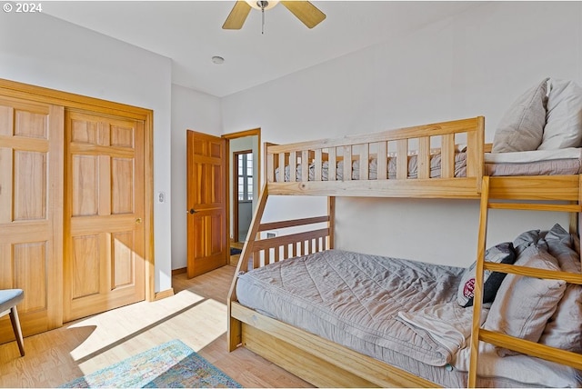 bedroom with ceiling fan and light hardwood / wood-style flooring