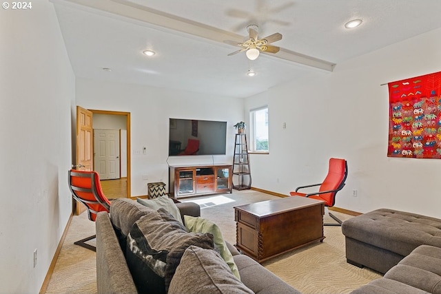 carpeted living room featuring ceiling fan and beam ceiling