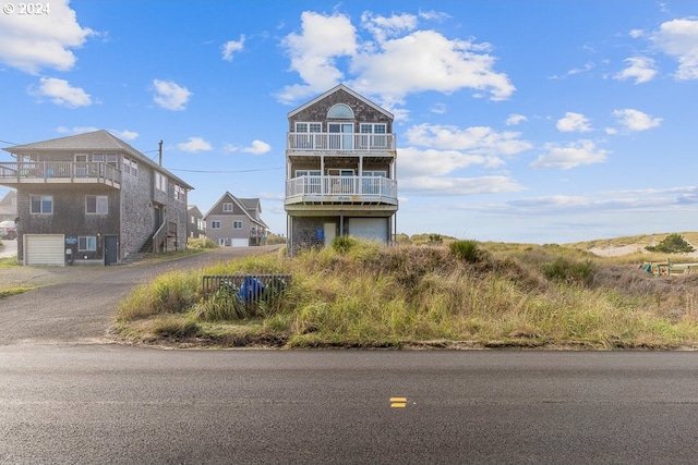 view of front of house featuring a balcony