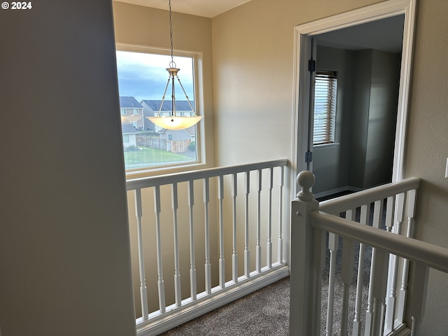 hallway featuring carpet flooring