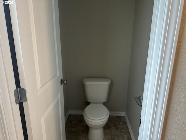 bathroom featuring tile patterned floors and toilet