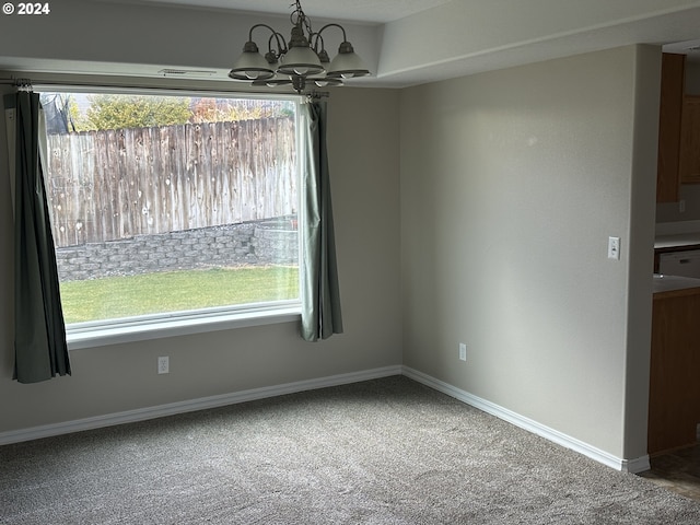 unfurnished dining area with carpet and plenty of natural light