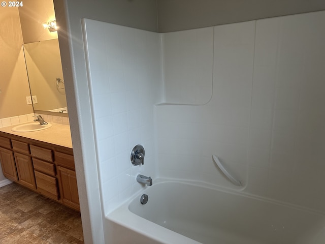 bathroom with shower / bathing tub combination and vanity