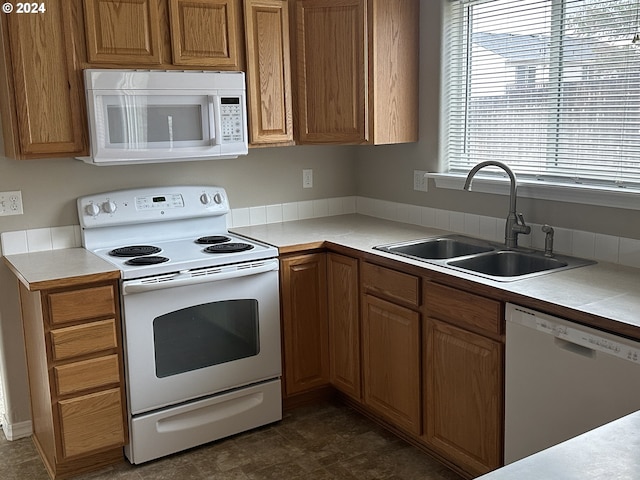 kitchen with sink and white appliances