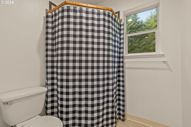 bathroom featuring tile patterned floors and toilet